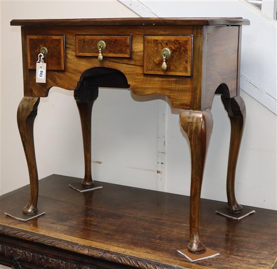 A George I style cross-banded and feather-banded walnut lowboy on cabriole legs H.75.5cm, W.76cm